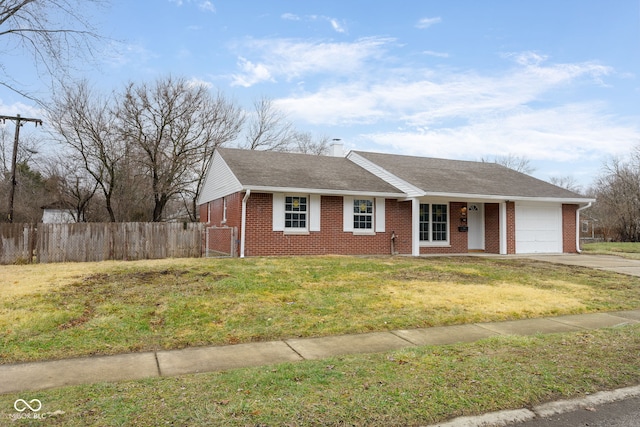 ranch-style house featuring a garage and a front yard