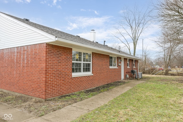 view of home's exterior featuring a yard and central air condition unit