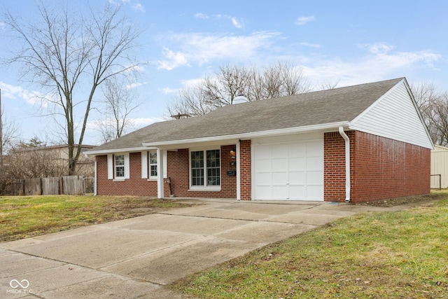 single story home featuring a garage and a front lawn