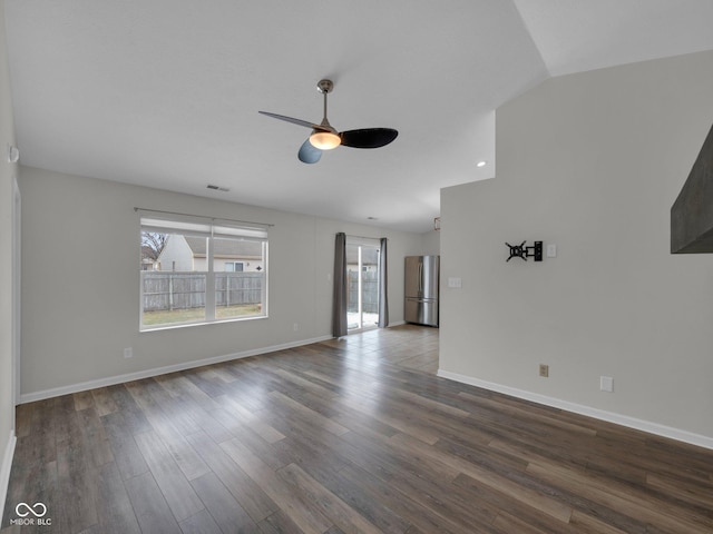 unfurnished living room with hardwood / wood-style flooring, vaulted ceiling, and ceiling fan