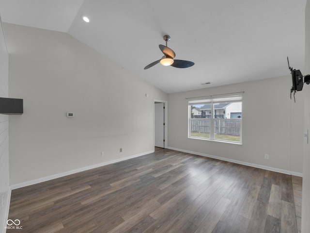 unfurnished room featuring ceiling fan, lofted ceiling, and dark hardwood / wood-style flooring