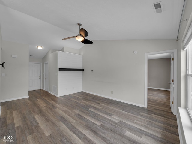 unfurnished living room with vaulted ceiling, wood-type flooring, and ceiling fan