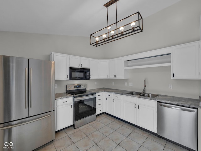 kitchen with stone countertops, sink, white cabinets, and appliances with stainless steel finishes