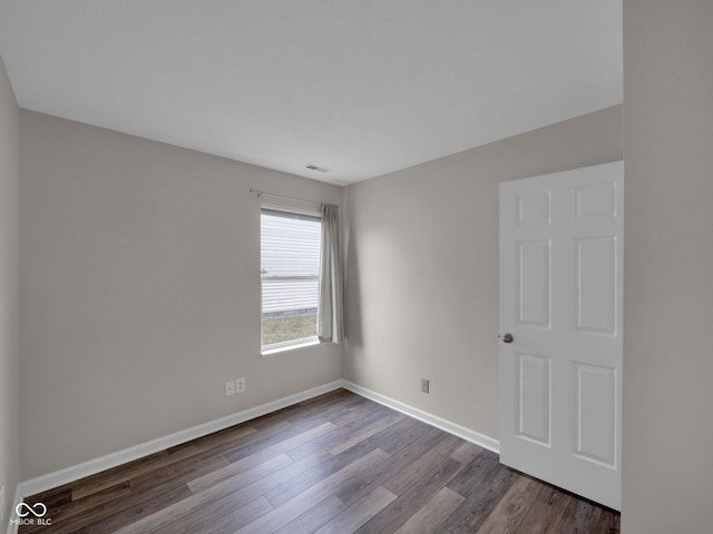 spare room featuring hardwood / wood-style flooring