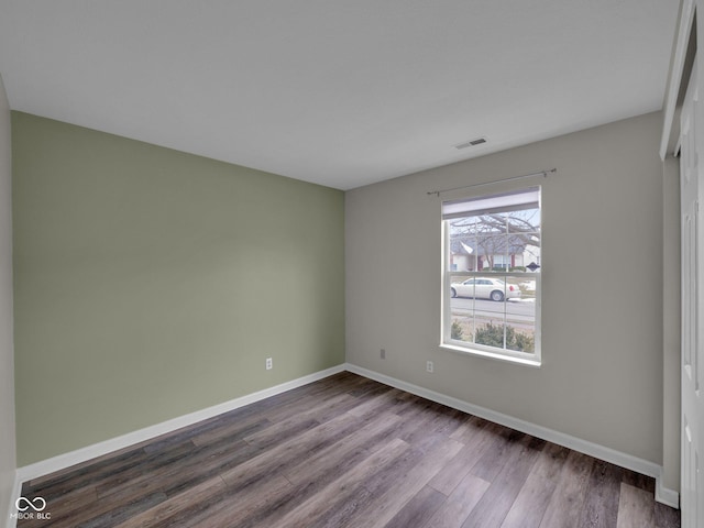 unfurnished room featuring hardwood / wood-style floors