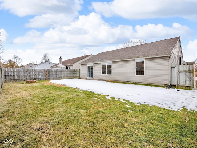 rear view of house featuring a patio and a lawn