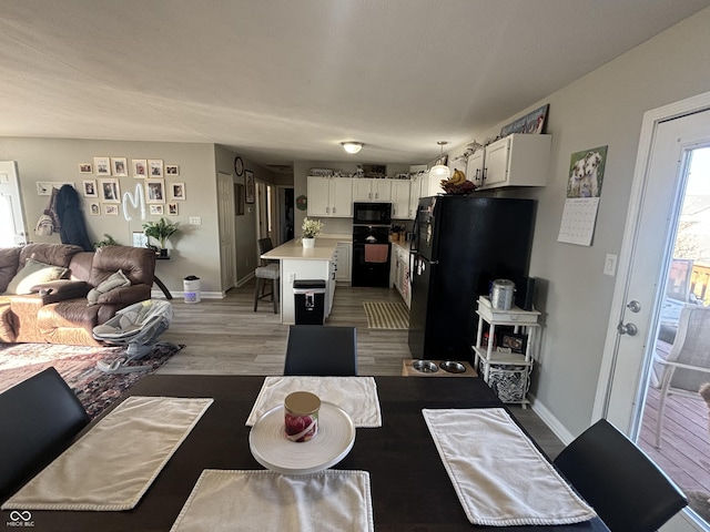 dining room featuring wood-type flooring