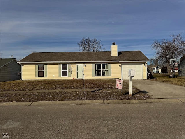 ranch-style house featuring a garage