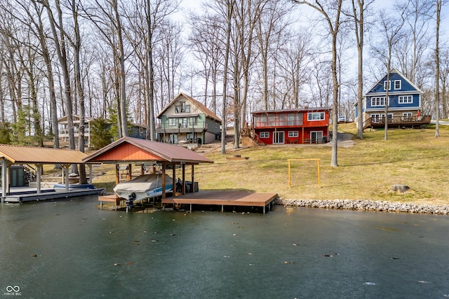 dock area featuring a water view and a yard