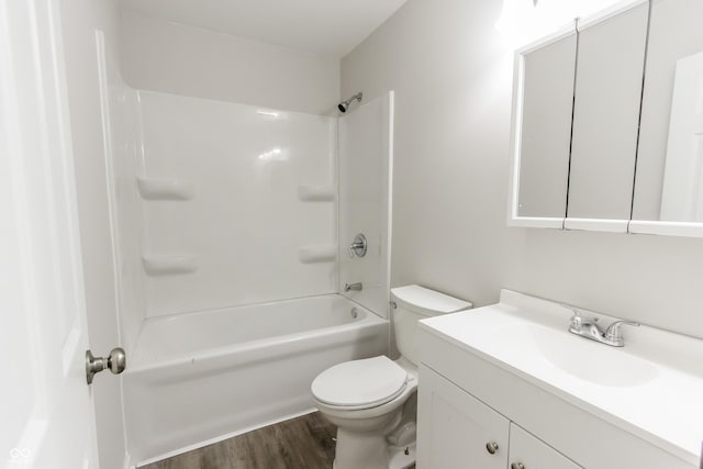 full bathroom featuring vanity, hardwood / wood-style flooring, shower / bathtub combination, and toilet