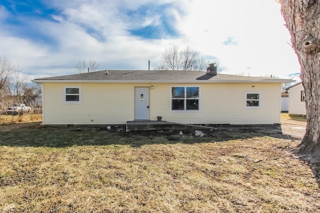 back of house with a yard