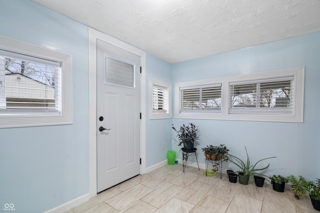 entrance foyer with a textured ceiling