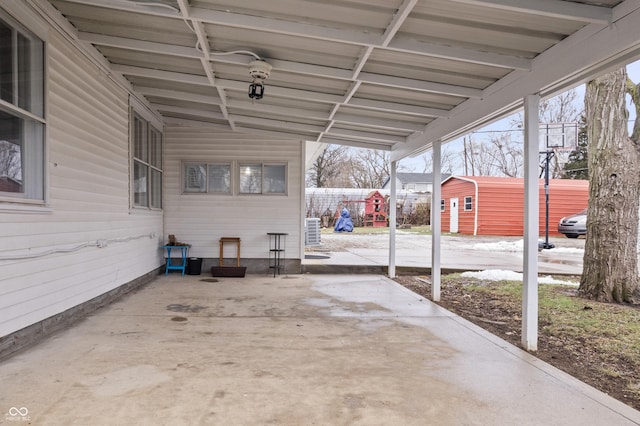 view of patio with a shed and central AC