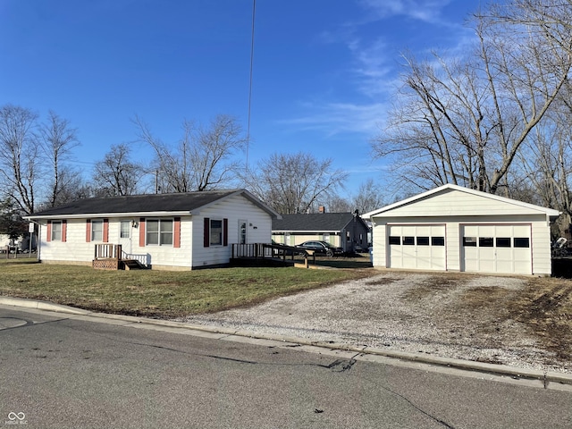 view of front of house with a garage and a front lawn