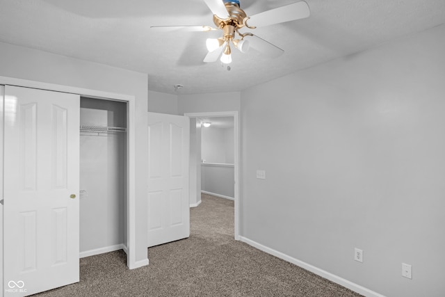 unfurnished bedroom featuring ceiling fan, carpet flooring, and a closet