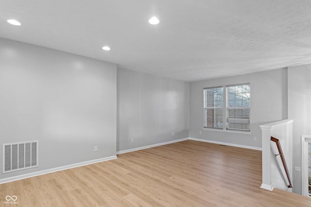 unfurnished living room featuring light hardwood / wood-style floors