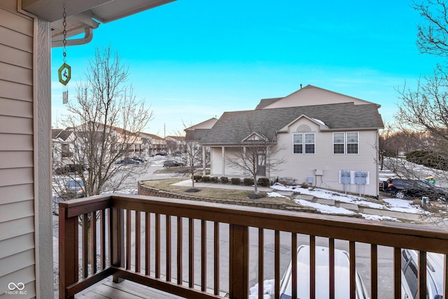 view of snow covered back of property