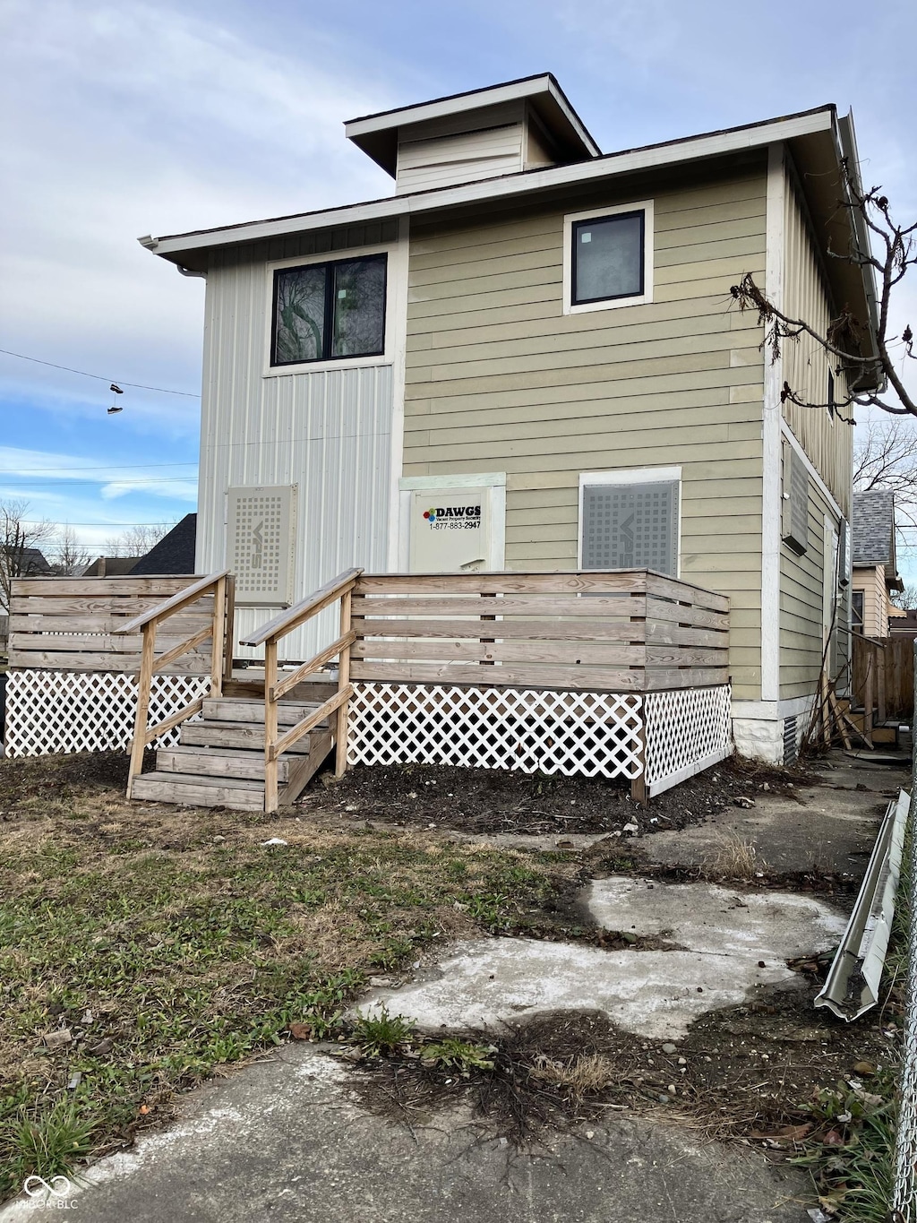 back of house featuring a deck