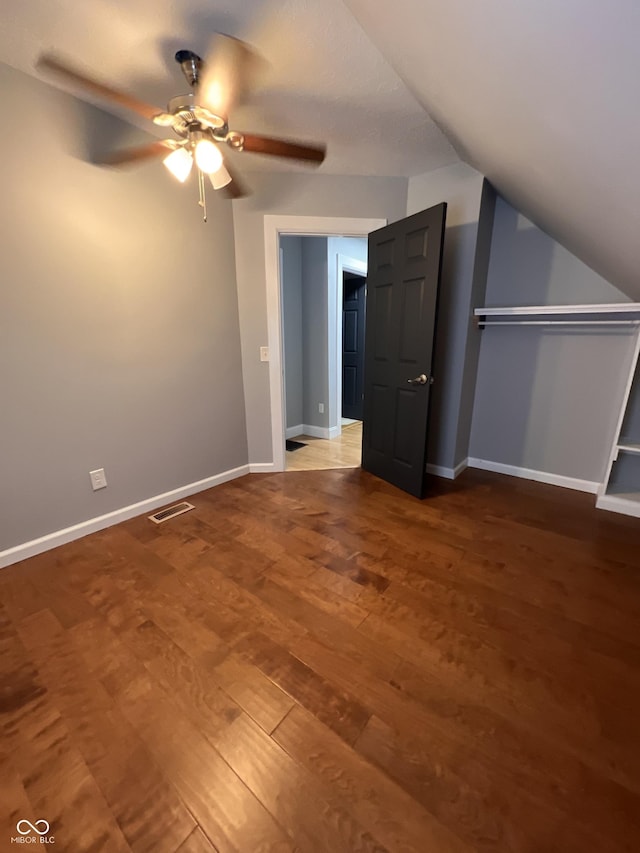 bonus room featuring hardwood / wood-style floors, vaulted ceiling, and ceiling fan