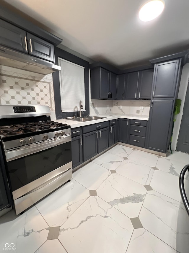 kitchen featuring sink, backsplash, and stainless steel range with gas stovetop