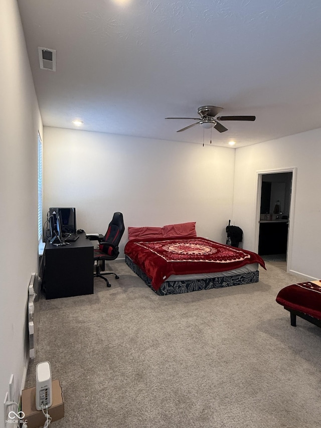 bedroom with ceiling fan and carpet flooring