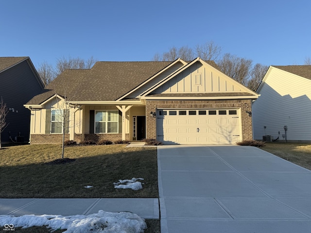 craftsman-style home with a garage and a front lawn