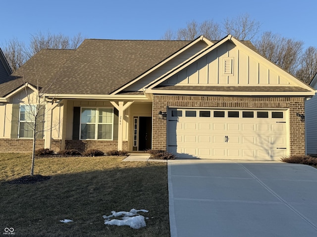 craftsman-style house with a garage and a front lawn