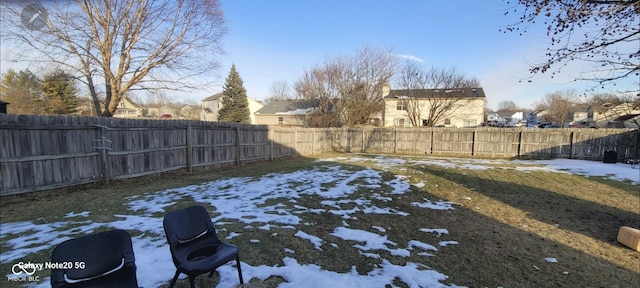 view of yard layered in snow