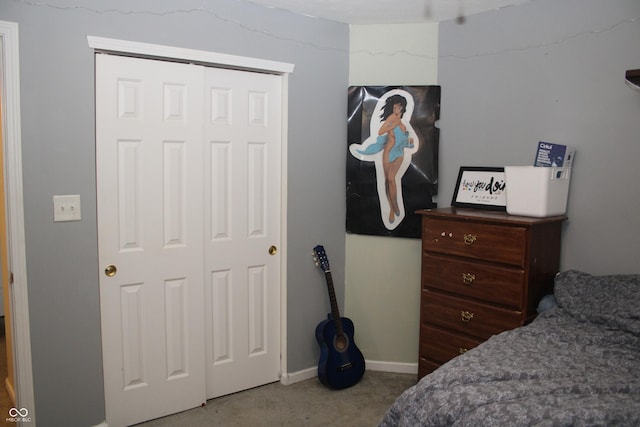 carpeted bedroom featuring a closet