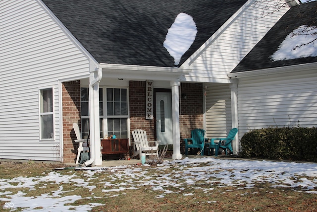 view of snow covered property entrance