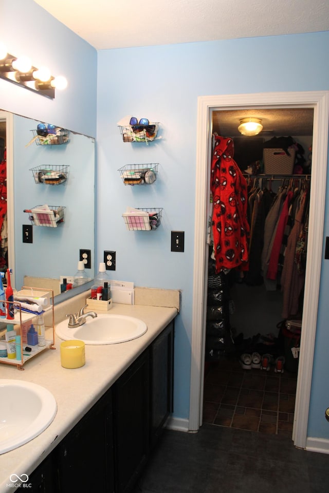 bathroom with vanity and tile patterned flooring