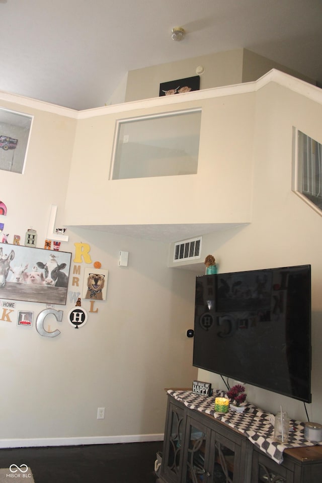 laundry area with dark wood-type flooring