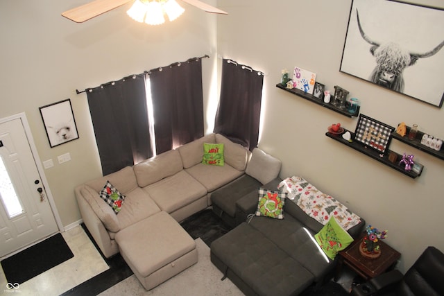 unfurnished living room featuring ceiling fan