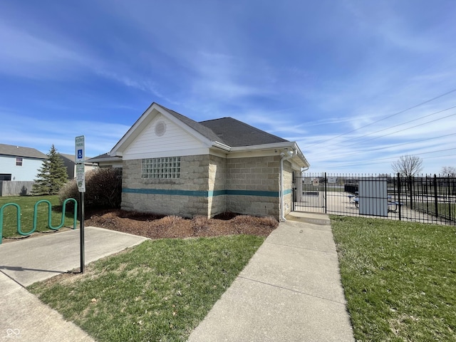 7842 Cork Bend Ln, Indianapolis, IN 46239 - view of side of home with a lawn, fence, and roof with shingles