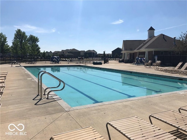 view of swimming pool featuring a patio area