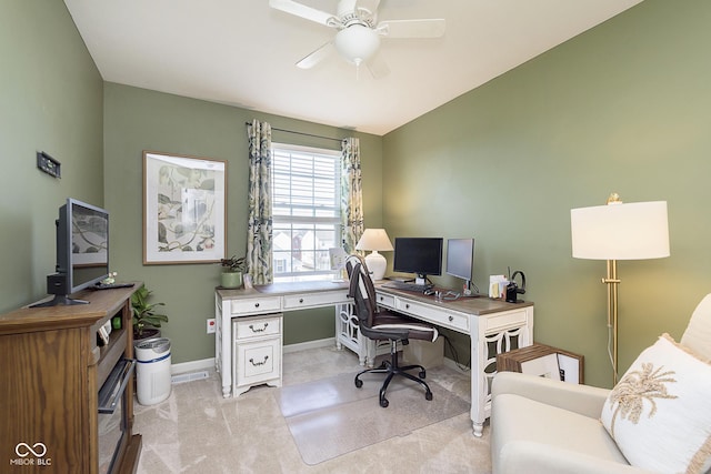 home office featuring light colored carpet and ceiling fan