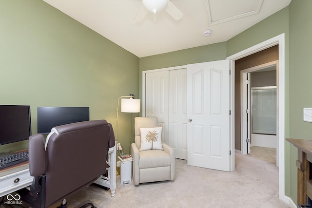 home office featuring ceiling fan and light colored carpet