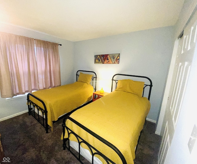 bedroom featuring dark colored carpet