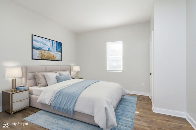 bedroom with hardwood / wood-style flooring