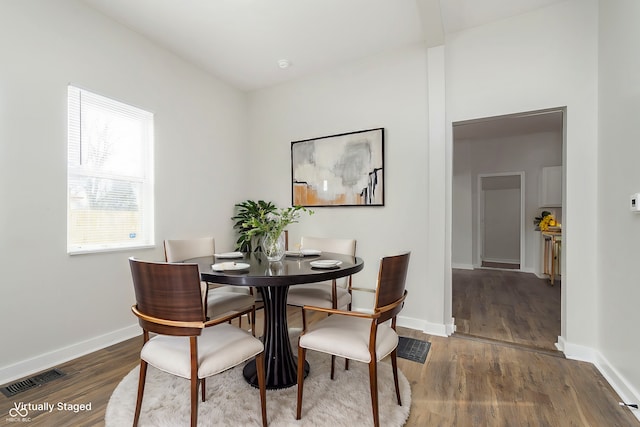 dining room featuring dark wood-type flooring