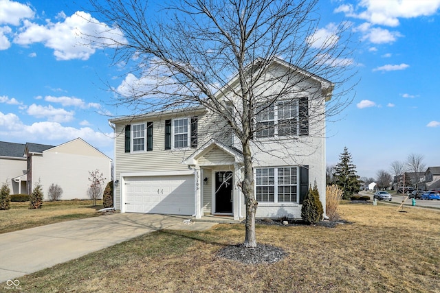 view of property with a garage and a front yard