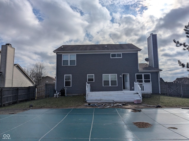 back of house featuring a pool side deck