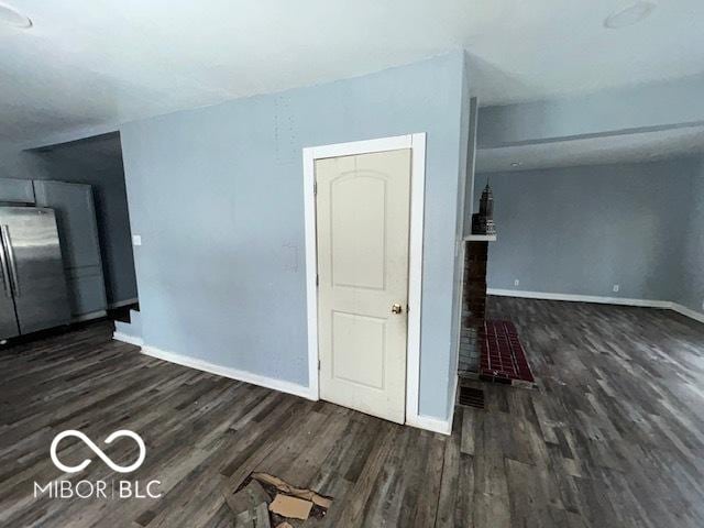 empty room with dark hardwood / wood-style floors