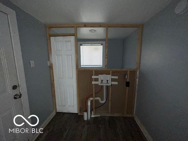 laundry area featuring dark hardwood / wood-style floors