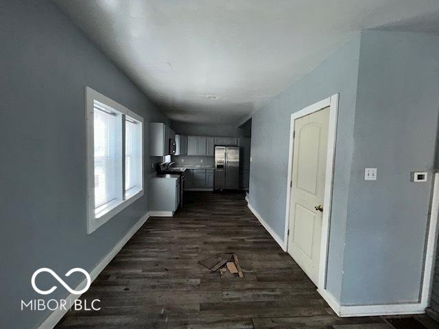 corridor featuring dark hardwood / wood-style flooring