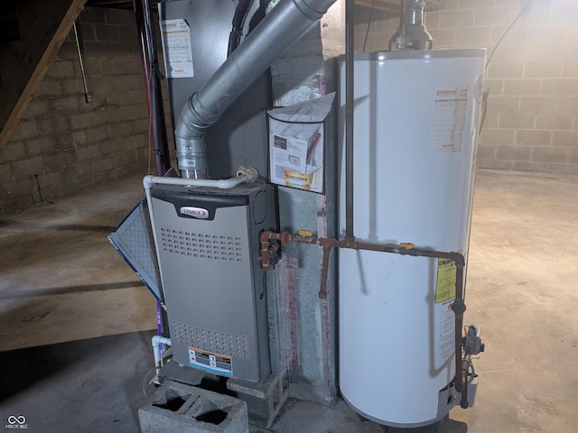 utility room featuring gas water heater