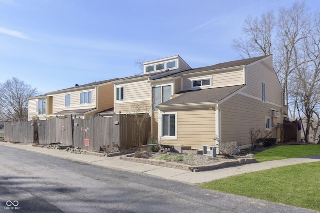 view of front of house featuring fence