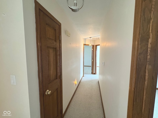 hallway with light carpet