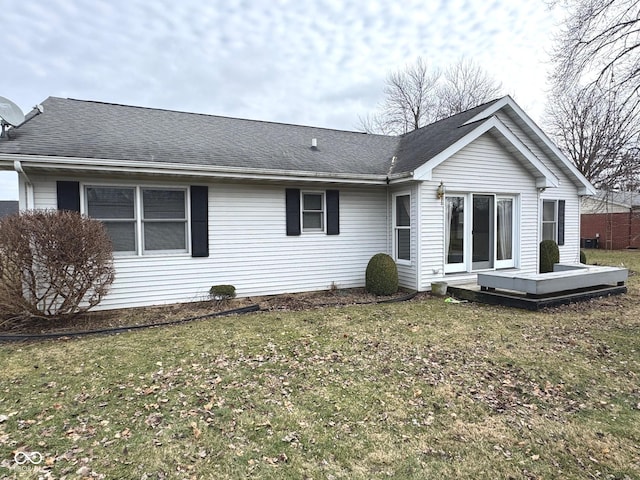 back of house with a yard