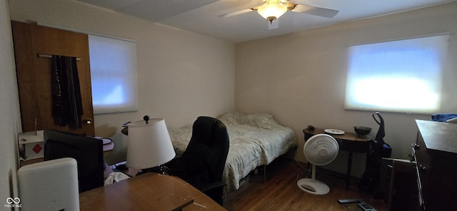 bedroom featuring wood-type flooring and ceiling fan